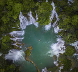 Aerial view of Detian Transnational Waterfalls along the river at Moon Hill Yangshuo valley, Chongzuo City, Yangshuo County, Guilin, Guangxi Zhuang Autonomous Region, China. - AAEF26216