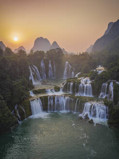 Aerial view of Detian Transnational Waterfalls along the river at Moon Hill Yangshuo valley, Chongzuo City, Yangshuo County, Guilin, Guangxi Zhuang Autonomous Region, China. - AAEF26223