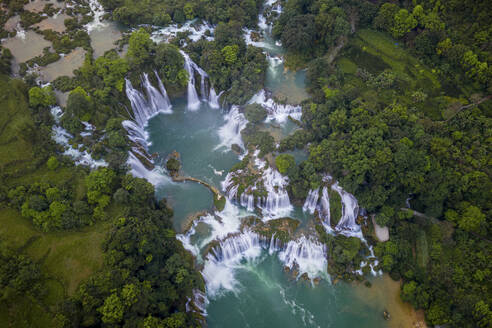 Aerial view of Detian Transnational Waterfalls along the river at Moon Hill Yangshuo valley, Chongzuo City, Yangshuo County, Guilin, Guangxi Zhuang Autonomous Region, China. - AAEF26224