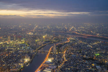 Aerial view of Tokyo skyline at sunset along the Sumida river, Japan. - AAEF26231