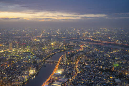 Aerial view of Tokyo skyline at sunset along the Sumida river, Japan. - AAEF26231