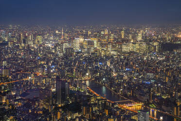 Aerial view of Tokyo skyline at sunset along the Sumida river, Japan. - AAEF26232