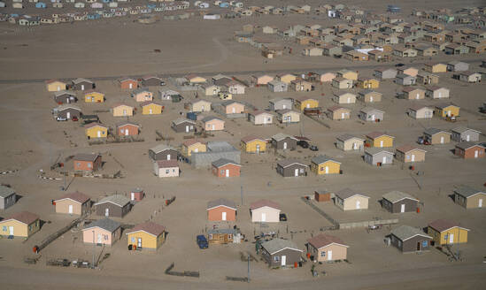 Aerial view of a few houses near Walvis Bay, Namib Desert, Namibia, Africa. - AAEF26241