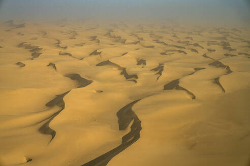 Aerial view of the Namib Desert with sand dunes along the Atlantic Ocean coastline, Namibia, Africa. - AAEF26242