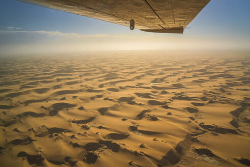 Aerial view of the Namib Desert with sand dunes along the Atlantic Ocean coastline, Namibia, Africa. - AAEF26243