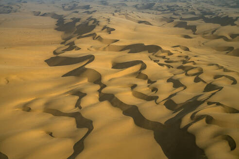 Aerial view of the Namib Desert with sand dunes along the Atlantic Ocean coastline, Namibia, Africa. - AAEF26244