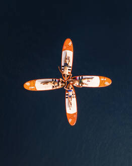 Aerial view of girls surfing with a red surfboard in the blue ocean, Primorje-Gorski Kotar, Croatia. - AAEF26248