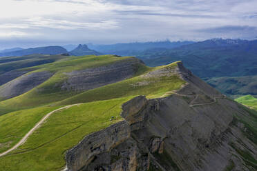 Aerial view of mountain landscape with ridge across the canyon at sunset, Karachay-Cherkess, Khabaz, Kebardino Balkaria, Caucasus, Russia. - AAEF26272