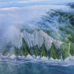 Aerial view of Iturup Island along Sea of Okhotsk coastline, Kuril Archipelago, Sakhalin Oblast, Russia. - AAEF26283