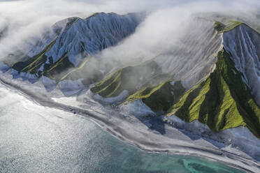 Aerial panoramic view of Iturup Island along Sea of Okhotsk coastline, Kuril Archipelago, Sakhalin Oblast, Russia. - AAEF26288