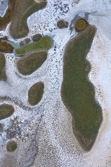 Aerial view of abstract water formation along the coastline of Elton Lake, a large salt lake with minerals in Vengelovskoe, Volgograd Oblast, Russia. - AAEF26385