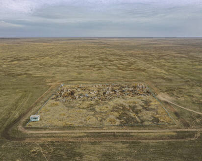 Aerial view of a small cemetery along Elton Lake in Vengelovskoe, Volgograd Oblast, Russia. - AAEF26404