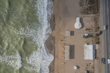 Aerial view of Bathhouse along the shoreline on the beach facing the Black Sea, Crimea Region, Autonomous Republic of Crimea, Ukraine. - AAEF26423