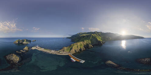 Aerial panoramic view of a pier and promontory on Ostrov Moneron island Nevelsk, Sakhalin Oblast, Russia. - AAEF26428