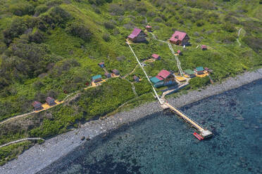 Aerial panoramic view of a pier and promontory on Ostrov Moneron island Nevelsk, Sakhalin Oblast, Russia. - AAEF26436