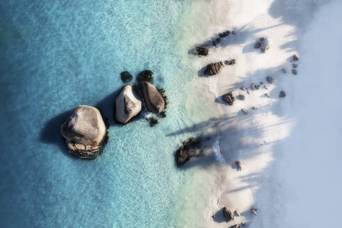 Aerial view of three large boulders in crystal clear blue water and a white sandy beach, Cape Town, Western Cape, South Africa. - AAEF26500