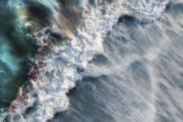 Aerial view of a blue ocean wave breaking with white foam and lots of texture, Wilderness, Western Cape, South Africa. - AAEF26503
