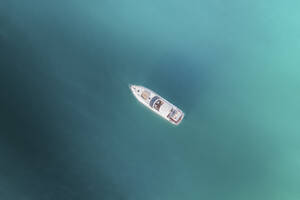 Aerial view of a luxury yacht anchored in a coastal bay in blue water, Cape Town, Western Cape, South Africa. - AAEF26520