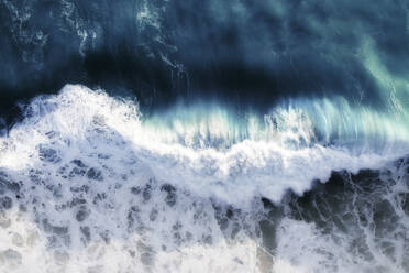 Aerial view of a blue ocean wave breaking with white foam and lots of texture, Cape Town, Western Cape, South Africa. - AAEF26525