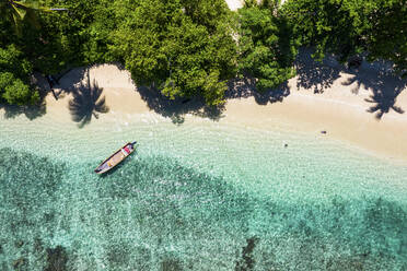 Aerial Drone View of Boat on the Beach, Musho Island, Wewak East Sepik Province, Papua New Guinea. - AAEF26886