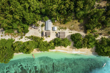 Aerial Top Down View of Wooden Houses on the Beach, Musho Island, Wewak, East Sepik Province, Papua New Guinea. - AAEF26891