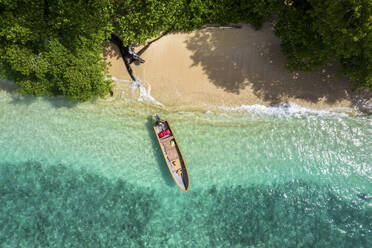 Aerial Top Down View of Boat in Water, Musho Island, Wewak, East Sepik Province, Papua New Guinea. - AAEF26893