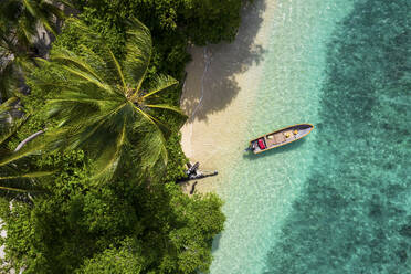 Aerial Drone View of Boat on Seaside, Musho Island, Wewak, East Sepik Province, Papua New Guinea. - AAEF26894
