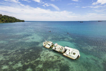 Aerial Drone View of Old Shipwreck in Bismarck Sea, Wewak East Sepik Province, Papua New Guinea. - AAEF26902