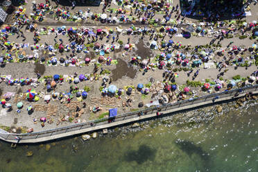 Aerial Drone View of People on Street Market, Wewak Town, East Sepik Province, Papua New Guinea. - AAEF26914