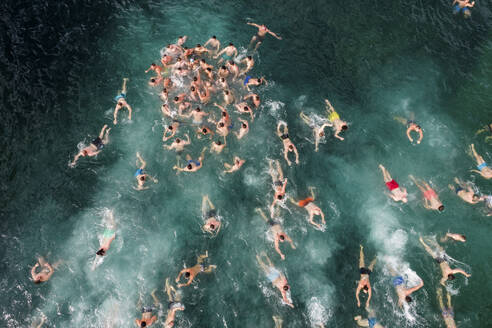 Aerial Drone View of People Swimming in Cold Water in the Winter, Epiphany Christian Holiday, Varna, Bulgaria. - AAEF26943