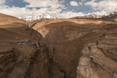 Aerial view of the Chicham Bridge crossing the canyon and the River Spiti Tributary, Kaza, Himachal Pradesh, India. - AAEF26951