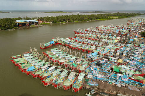 Aerial view of many boats and fishing boats docket at Malpe New Port, Udupi, Karnataka, India. - AAEF26993