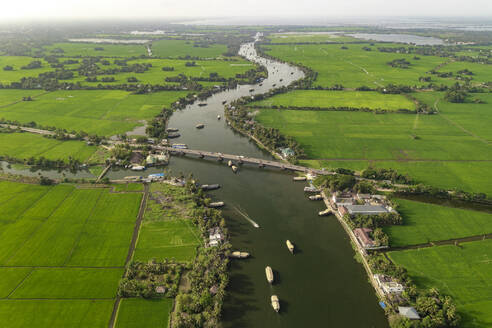 Aerial view of boats sailing the river water in Alappuzha, Kerala, India. - AAEF27004