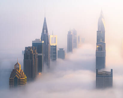 Aerial view of Downtown Dubai with golden sunrise, fog and skyscrapers, Dubai, United Arab Emirates. - AAEF27017