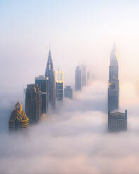 Aerial view of downtown Dubai with fog and mist, Shangri La Dubai and Sheik Zayed Road, United Arab Emirates. - AAEF27018