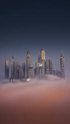 Aerial view of Dubai Marina at twilight with Cayan Tower, fog and skyscrapers, Dubai, United Arab Emirates. - AAEF27020