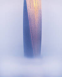 Aerial view of Cayan Tower with fog, Dubai, United Arab Emirates. - AAEF27023