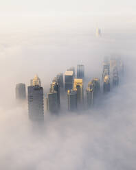 Aerial view of Dubai in foggy sunrise, Jumeirah Lake Towers, Dubai, UAE. - AAEF27030