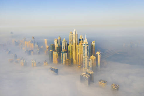 Aerial view of Dubai Marina with foggy sunrise, Dubai, United Arab Emirates. - AAEF27032