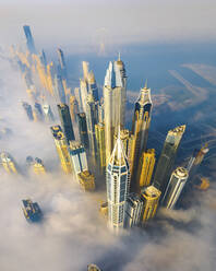 Aerial view of Dubai Marina at sunrise with fog and yachts, Dubai, United Arab Emirates. - AAEF27034