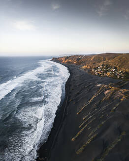 Aerial view of Playa Las Brisas beach and rugged coastline, O'Higgins, Chile. - AAEF27086