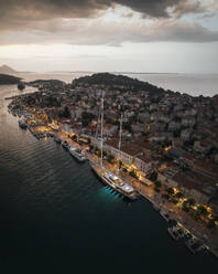 Aerial view of a beautiful coastal town with luxury yachts and sailboats in the harbor, Mali Losinj, Primorje-Gorski Kotar, Croatia. - AAEF27139