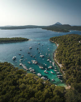 Aerial view of idyllic Otok Kolundarc Island with clear turquoise water, Primorje-Gorski Kotar, Croatia. - AAEF27143