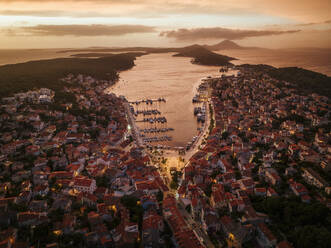 Aerial view of beautiful coastal town with red rooftops and marina, Mali Losinj, Primorje-Gorski Kotar, Croatia. - AAEF27145