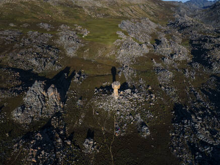 Aerial view of Maltese Cross amazing thirty meter rock formation at sunrise with tents, Cederberg, Western Cape, South Africa. - AAEF27155