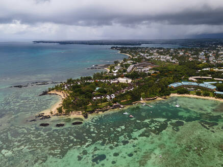 Aerial view of Pointe aux Canonniers coastline and clear Indian Ocean coastal reef, Grand Baie, Mauritius. - AAEF27159