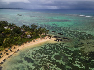 Aerial view of Pointe aux Canonniers coastline and clear Indian Ocean coastal reef, Grand Baie, Mauritius. - AAEF27164