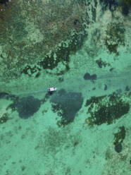 Aerial view of small fishing boat, Pointe aux Canonniers, Grand Baie, Mauritius. - AAEF27168