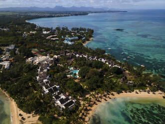 Aerial view of Pointe aux Canonniers coastline and clear Indian Ocean coastal reef, Grand Baie, Mauritius. - AAEF27170