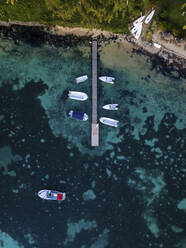 Aerial view of dock at Pointe aux Canonniers coastline and clear Indian Ocean coastal reef, Grand Baie, Mauritius. - AAEF27176